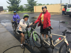 Cyclists wash bikes